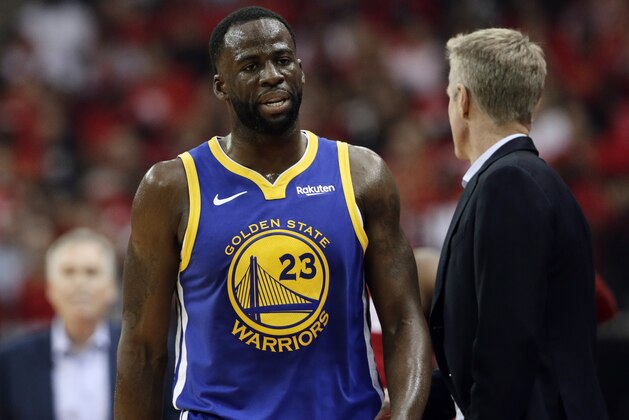 Golden State Warriors' Draymond Green (23) walks to the sideline past head coach Steve Kerr, right, during the first half of Game 6 of a second-round NBA basketball playoff series, Friday, May 10, 2019, in Houston. (AP Photo/Eric Gay)