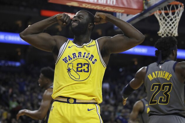 Golden State Warriors' Draymond Green, left, celebrates a score against the Indiana Pacers during the second half of an NBA basketball game Thursday, March 21, 2019, in Oakland, Calif. (AP Photo/Ben Margot)