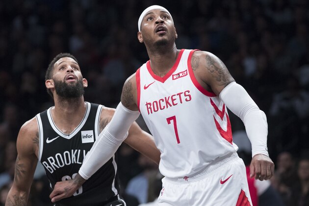 Houston Rockets forward Carmelo Anthony (7) and Brooklyn Nets guard Allen Crabbe (33) vie for position during a free throw during the second half of an NBA basketball game, Friday, Nov. 2, 2018, in New York. The Rockets won 119-111. (AP Photo/Mary Altaffer)