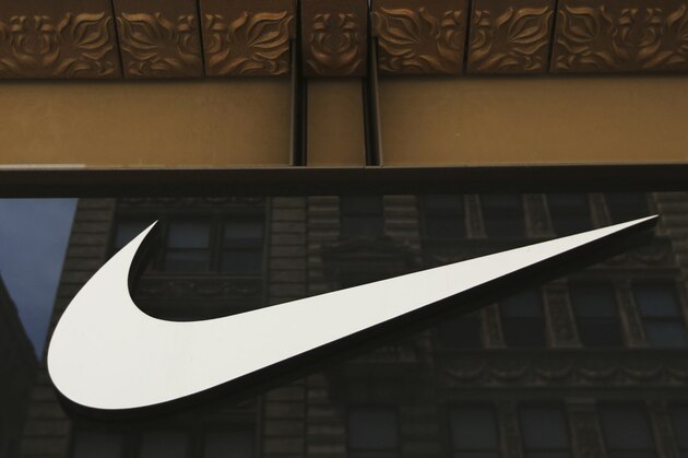 FILE - In this Thursday, June 15, 2017, file photo, the Nike logo adorns the Nike SoHo store, in the SoHo neighborhood of New York. Nike, Inc. reports earnings, Thursday, June 29, 2017. (AP Photo/Michael Noble Jr., File)
