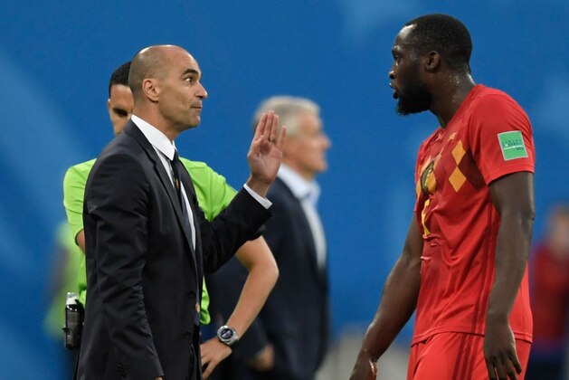Belgium's coach Roberto Martinez (L) speaks with Belgium's forward Romelu Lukaku during the Russia 2018 World Cup semi-final football match between France and Belgium at the Saint Petersburg Stadium in Saint Petersburg on July 10, 2018. (Photo by GABRIEL BOUYS / AFP) / RESTRICTED TO EDITORIAL USE - NO MOBILE PUSH ALERTS/DOWNLOADS        (Photo credit should read GABRIEL BOUYS/AFP/Getty Images)