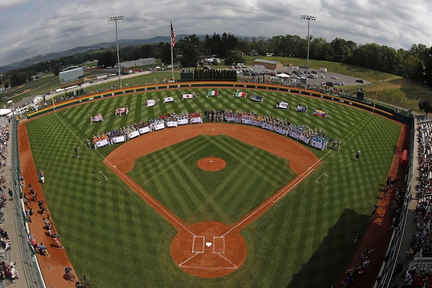 The 16 Little League Regional Champion teams ring the infield of Volunteer Stadium during the opening ceremony of the 2019 Little League World Series tournament in South Williamsport, Pa.,Thursday, Aug. 15, 2019. (AP Photo/Gene J. Puskar)