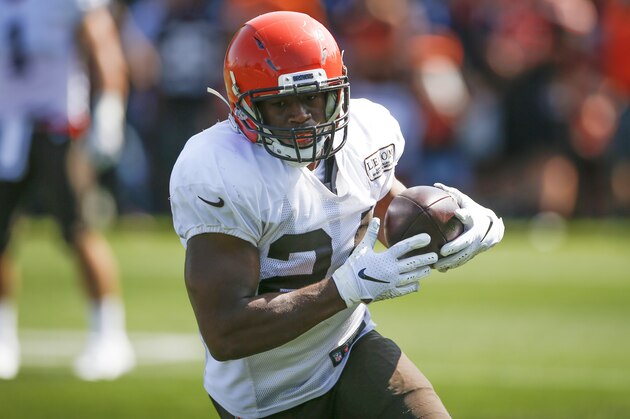 Cleveland Browns running back Nick Chubb (24) runs through a drill during practice at the NFL football team's training facility Monday, Aug. 5, 2019, in Berea, Ohio. (AP Photo/Ron Schwane)