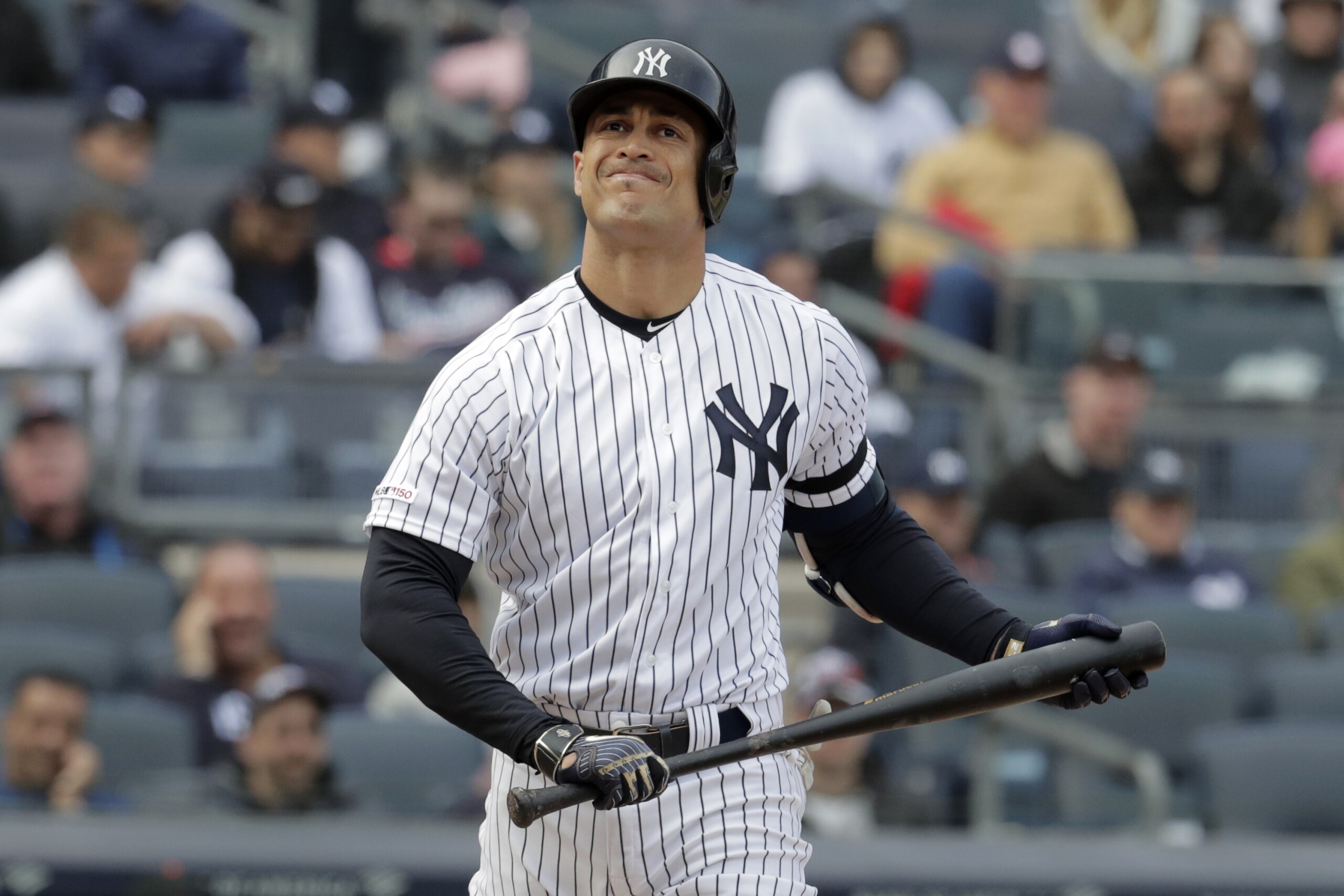 New York Yankees' Giancarlo Stanton reacts after striking out to Baltimore Orioles relief pitcher Paul Fry during the eighth inning of an opening day baseball game at Yankee Stadium, Thursday, March 28, 2019, in New York. The Yankees won 7-2. (AP Photo/Julio Cortez) New York Yankees' Giancarlo Stanton reacts after striking out to Baltimore Orioles relief pitcher Paul Fry during the eighth inning of an opening day baseball game at Yankee Stadium, Thursday, March 28, 2019, in New York. The Yankees won 7-2. (AP Photo/Julio Cortez)