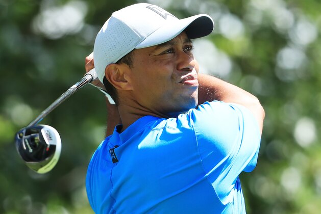 MEDINAH, ILLINOIS - AUGUST 15: Tiger Woods of the United States plays his shot from the third tee during the first round of the BMW Championship at Medinah Country Club No. 3 on August 15, 2019 in Medinah, Illinois. (Photo by Andrew Redington/Getty Images)