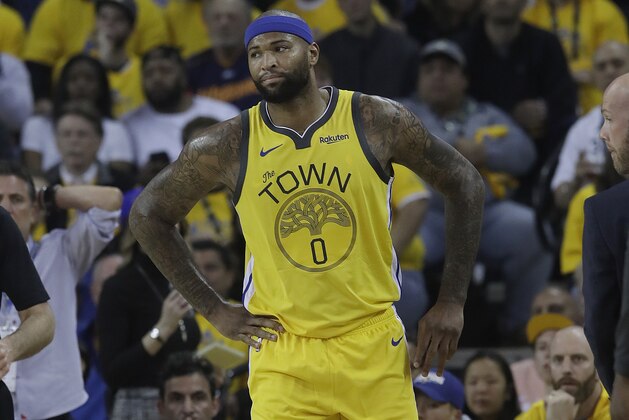 Golden State Warriors center DeMarcus Cousins reacts after injuring his leg during the first half of Game 2 of a first-round NBA basketball playoff series against the Los Angeles Clippers in Oakland, Calif., Monday, April 15, 2019. (AP Photo/Jeff Chiu)