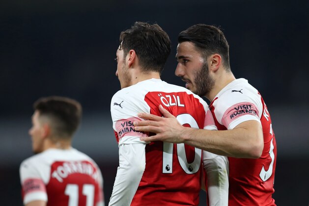 LONDON, ENGLAND - FEBRUARY 27: Sead Kolasinac of Arsenal speaks to Mesut Ozil of Arsenal  during the Premier League match between Arsenal FC and AFC Bournemouth at Emirates Stadium on February 27, 2019 in London, United Kingdom. (Photo by Catherine Ivill/Getty Images)