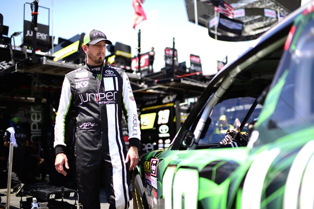 BRISTOL, TENNESSEE - AUGUST 15: Kyle Busch, driver of the #18 Juniper Toyota, stands in the garage area during practice for the NASCAR Xfinity Series Food City 300 at Bristol Motor Speedway on August 15, 2019 in Bristol, Tennessee. (Photo by Jared C. Tilton/Getty Images)