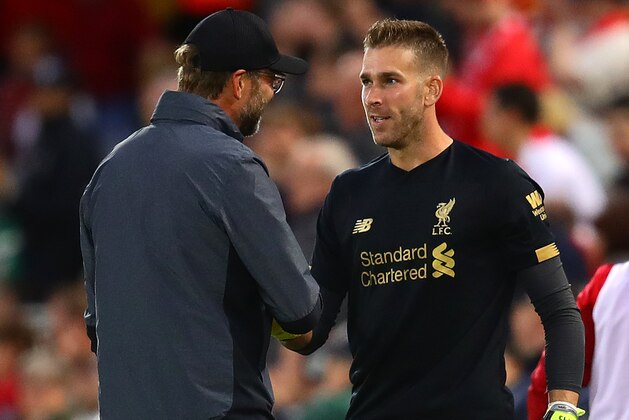 LIVERPOOL, ENGLAND - AUGUST 09: Liverpool manager Jurgen Klopp shakes hands with Adrian before he enters the field during the Premier League match between Liverpool FC and Norwich City at Anfield on August 09, 2019 in Liverpool, United Kingdom. (Photo by Chris Brunskill/Fantasista/Getty Images)