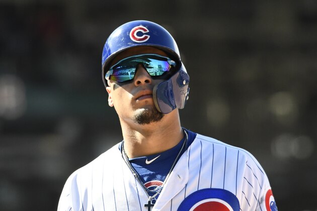 Chicago Cubs' Javier Baez (9) looks into the stands after hitting a one run single against the Milwaukee Brewers during the eighth inning of a baseball game, Saturday, Aug. 3, 2019, in Chicago. (AP Photo/David Banks)