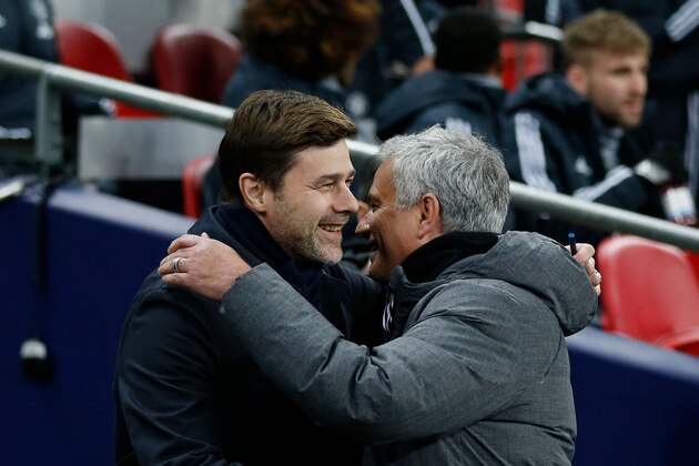 Manchester United's Portuguese manager Jose Mourinho (R) greets Tottenham Hotspur's Argentinian head coach Mauricio Pochettino (L) for the English Premier League football match between Tottenham Hotspur and Manchester United at Wembley Stadium in London, on January 31, 2018. / AFP PHOTO / IKIMAGES / Ian KINGTON / RESTRICTED TO EDITORIAL USE. No use with unauthorized audio, video, data, fixture lists, club/league logos or 'live' services. Online in-match use limited to 45 images, no video emulation. No use in betting, games or single club/league/player publications.  /         (Photo credit should read IAN KINGTON/AFP/Getty Images)