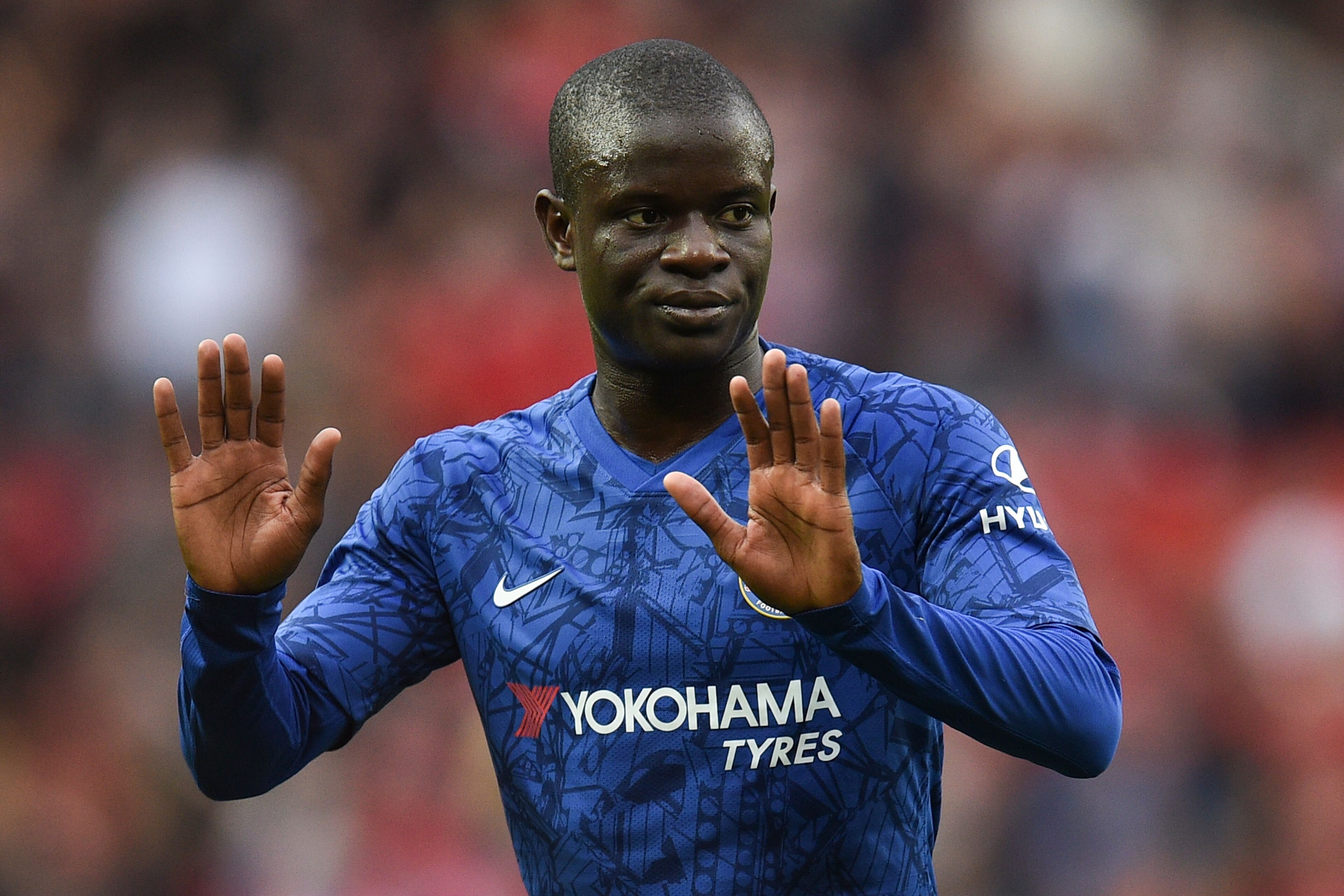 Chelsea's French midfielder N'Golo Kante reacts on the pitch at the final whistle in the English Premier League football match between Manchester United and Chelsea at Old Trafford in Manchester, north west England, on August 11, 2019. - Manchester United won the game 4-0. (Photo by Oli SCARFF / AFP) / RESTRICTED TO EDITORIAL USE. No use with unauthorized audio, video, data, fixture lists, club/league logos or 'live' services. Online in-match use limited to 120 images. An additional 40 images may be used in extra time. No video emulation. Social media in-match use limited to 120 images. An additional 40 images may be used in extra time. No use in betting publications, games or single club/league/player publications. /         (Photo credit should read OLI SCARFF/AFP/Getty Images)