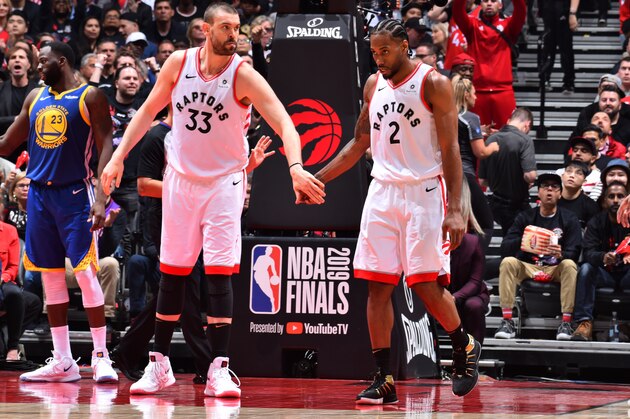 TORONTO, CANADA - MAY 30: Marc Gasol #33 of the Toronto Raptors and Kawhi Leonard #2 of the Toronto Raptors high-five during a game against the Golden State Warriors during Game One of the NBA Finals on May 30, 2019 at Scotiabank Arena in Toronto, Ontario, Canada. NOTE TO USER: User expressly acknowledges and agrees that, by downloading and/or using this photograph, user is consenting to the terms and conditions of the Getty Images License Agreement. Mandatory Copyright Notice: Copyright 2019 NBAE (Photo by Jesse D. Garrabrant/NBAE via Getty Images)
