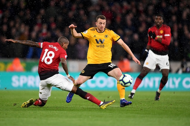WOLVERHAMPTON, ENGLAND - APRIL 02:  Ashley Young of Manchester United and Diogo Jota of Wolverhampton Wanderers during the Premier League match between Wolverhampton Wanderers and Manchester United at Molineux on April 2, 2019 in Wolverhampton, United Kingdom. (Photo by Sam Bagnall - AMA/Getty Images)