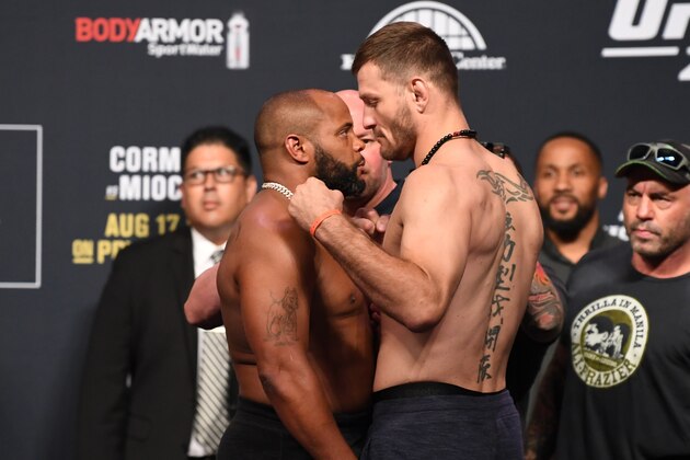ANAHEIM, CALIFORNIA - AUGUST 16:  (L-R) Daniel Cormier and Stipe Miocic face off during the UFC 241 weigh-in at the Anaheim Convention Center on August 16, 2019 in Las Vegas, Nevada. (Photo by Josh Hedges/Zuffa LLC/Zuffa LLC via Getty Images)