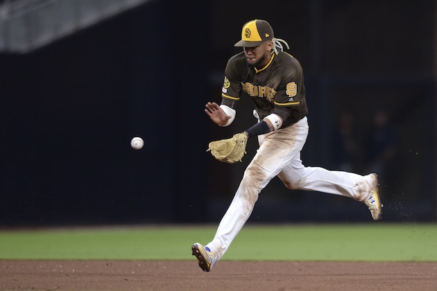 San Diego Padres shortstop Fernando Tatis Jr. fields a ground ball during the ninth inning of the baseball game against the Colorado Rockies Friday, Aug. 9, 2019, in San Diego. The Padres won 7-1. (AP Photo/Orlando Ramirez) San Diego Padres shortstop Fernando Tatis Jr. fields a ground ball during the ninth inning of the baseball game against the Colorado Rockies Friday, Aug. 9, 2019, in San Diego. The Padres won 7-1. (AP Photo/Orlando Ramirez)