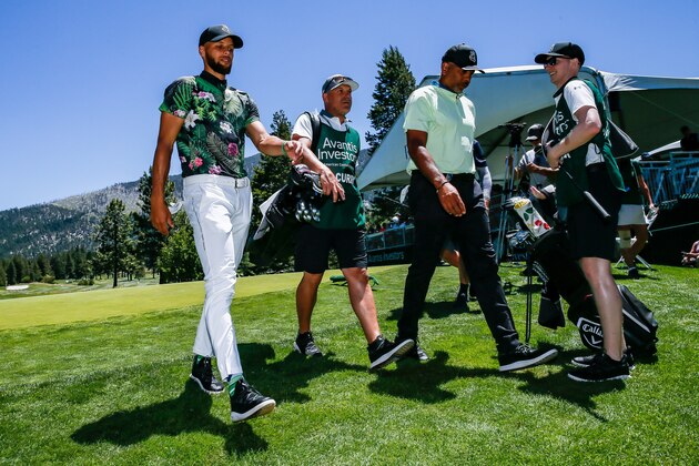 STATELINE, NEVADA - JULY 14: Steph Curry and father Dell Curry walk off of the 14th hole green during the final round of the American Century Championship at Edgewood Tahoe Golf Course on July 14, 2019 in Stateline, Nevada. (Photo by Jonathan Devich/Getty Images)