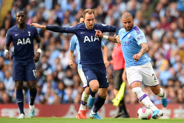 MANCHESTER, ENGLAND - AUGUST 17: Christian Eriksen of Tottenham Hotspur battles for possession with Kyle Walker of Manchester City  during the Premier League match between Manchester City and Tottenham Hotspur at Etihad Stadium on August 17, 2019 in Manchester, United Kingdom. (Photo by Shaun Botterill/Getty Images)