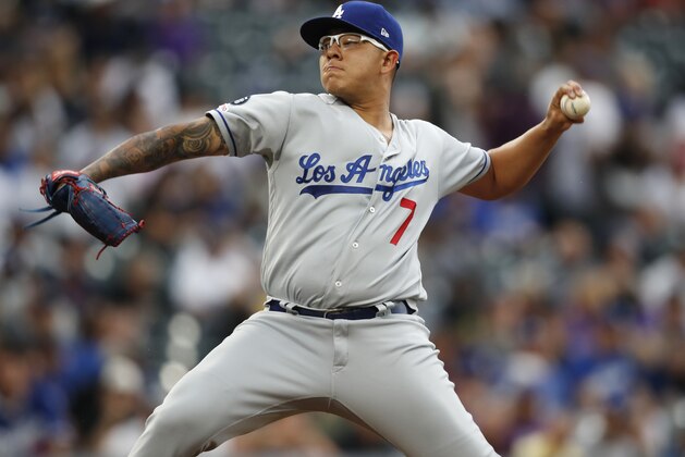 Los Angeles Dodgers starting pitcher Julio Urias works against the Colorado Rockies in the first inning of a baseball game Tuesday, July 30, 2019, in Denver. (AP Photo/David Zalubowski)