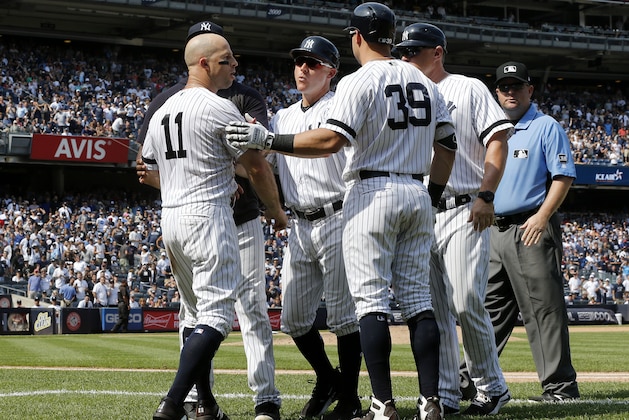 NEW YORK, NEW YORK - AUGUST 17:   Brett Gardner #11 of the New York Yankees is restrained by teammates as he argues with the umpires after his sixth inning ejection against the Cleveland Indians at Yankee Stadium on August 17, 2019 in New York City. (Photo by Jim McIsaac/Getty Images)