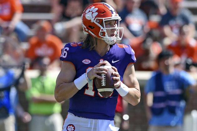 Clemson's Trevor Lawrence drops back to pass during Clemson's annual Orange and White NCAA college football spring scrimmage Saturday, April 6, 2019, in Clemson, S.C. (AP Photo/Richard Shiro)