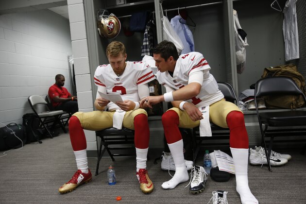 GLENDALE, AZ - OCTOBER 28: C.J. Beathard #3 and Nick Mullens #4 of the San Francisco 49ers go over plays in the locker room prior to the game against the Arizona Cardinals at State Farm Stadium on October 28, 2018 in Glendale, Arizona. The Cardinals defeated the 49ers 18-15. (Photo by Michael Zagaris/San Francisco 49ers/Getty Images)