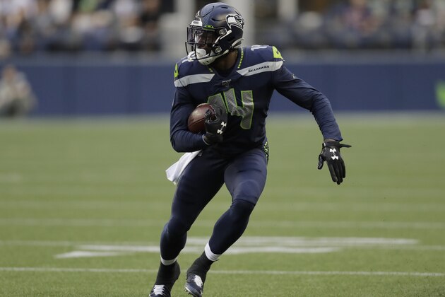 Seattle Seahawks wide receiver DK Metcalf runs after a reception against the Denver Broncos during the first half of an NFL football preseason game, Thursday, Aug. 8, 2019, in Seattle. (AP Photo/Stephen Brashear)