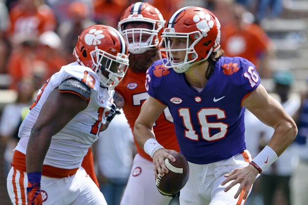 Clemson's Trevor Lawrence (16) scrambles out of the backfield during Clemson's annual Orange and White NCAA college football spring scrimmage Saturday, April 6, 2019, in Clemson, S.C. (AP Photo/Richard Shiro)
