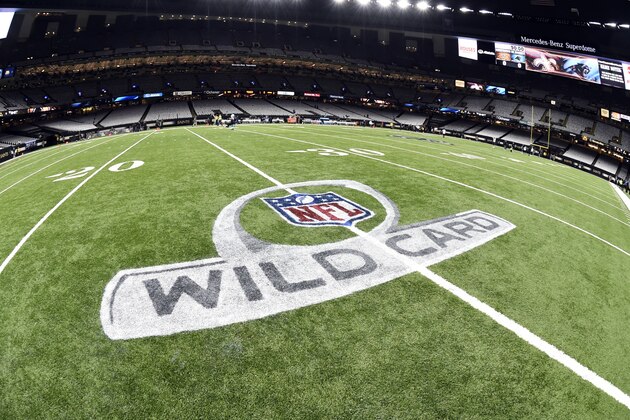 The NFL wild card playoff logo is seen on the field before an NFL football game between the New Orleans Saints and the Carolina Panthers in New Orleans, Sunday, Jan. 7, 2018. (AP Photo/Bill Feig)