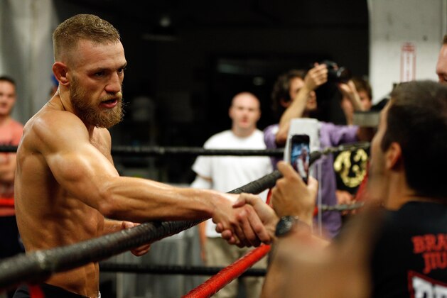 BOSTON, MA - AUGUST 13:  Irish featherweight Conor McGregor interacts with fans during an open training session for media at Peter Welch's Boxing Gym on August 13, 2013 in Boston, Massachusetts. (Photo by Josh Hedges/Zuffa LLC/Zuffa LLC via Getty Images)