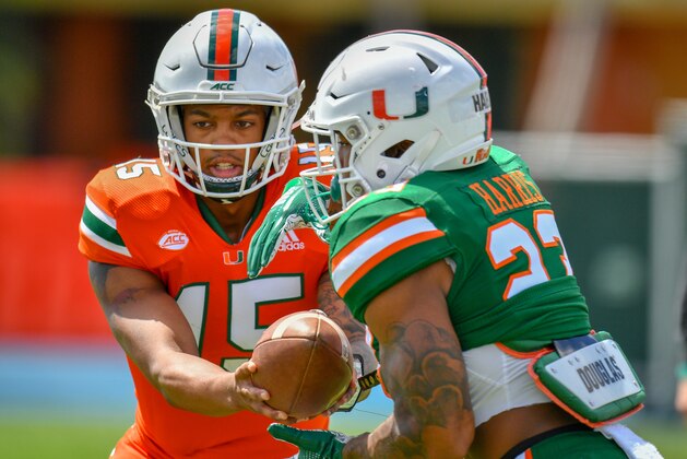 MIAMI, FL - APRIL 13: Jarren Williams #15 of the Miami Hurricanes hands the ball of to Cam'Ron Harris #23 during the annual Spring Game at Nathaniel Traz-Powell Stadium on April 13, 2019 in Miami, Florida. (Photo by Mark Brown/Getty Images)