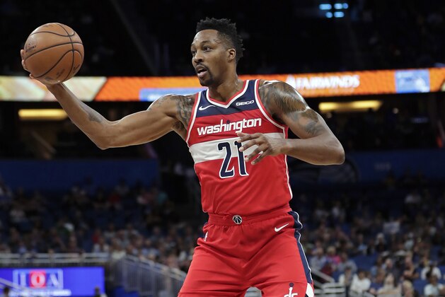 Washington Wizards' Dwight Howard takes a pass from a teammate during the first half of an NBA basketball game against the Orlando Magic, Friday, Nov. 9, 2018, in Orlando, Fla. (AP Photo/John Raoux)
