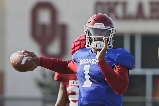 FILE - In this Monday, Aug. 5, 2019, file photo, Oklahoma quarterback Jalen Hurts throws during an NCAA college football practice in Norman, Okla. Hurts is competing with Tanner Mordecai, a redshirt freshman, and Spencer Rattler, a true freshman, to become starting quarterback.(AP Photo/Sue Ogrocki, File) FILE - In this Monday, Aug. 5, 2019, file photo, Oklahoma quarterback Jalen Hurts throws during an NCAA college football practice in Norman, Okla. Hurts is competing with Tanner Mordecai, a redshirt freshman, and Spencer Rattler, a true freshman, to become starting quarterback.(AP Photo/Sue Ogrocki, File)