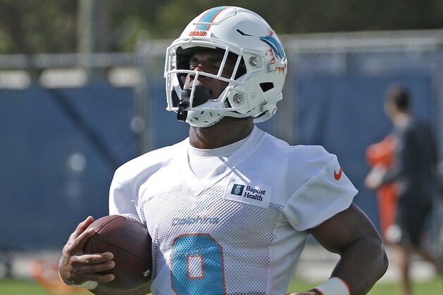 DAVIE, FL - JULY 26: Mark Walton #9 of the Miami Dolphins runs with the ball during the Miami Dolphins Training Camp at the Miami Dolphins training facility on July 26, 2019 in Davie, Florida. (Photo by Joel Auerbach/Getty Images)