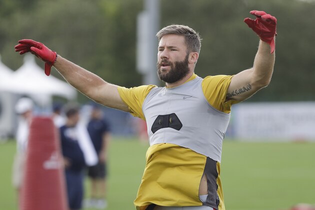 New England Patriots wide receiver Julian Edelman warms up during a combined NFL football training camp with the Tennessee Titans Wednesday, Aug. 14, 2019, in Nashville, Tenn. (AP Photo/Mark Humphrey)