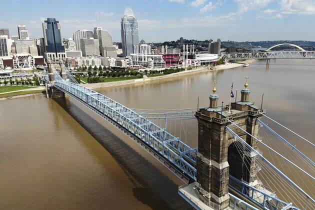 The Cincinnati skyline and John A. Roebling Suspension Bridge is seen from the banks of the Ohio River, Tuesday, Sept. 18, 2018, in Covington, Ky. (AP Photo/John Minchillo)