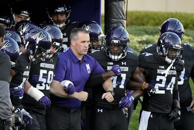 Northwestern head coach Pat Fitzgerald with his team against Akron before an NCAA college football game in Evanston, Ill., Saturday, Sept. 15, 2018. (AP Photo/Matt Marton)