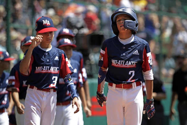 Elizabeth, New Jersey's Yamil Soto (2) and Jaime Tamayo (3) line up for the post-game handshake after a 6-0 loss to the West in a baseball game at the Little League World Series tournament in South Williamsport, Pa., Monday, Aug. 19, 2019. (AP Photo/Gene J. Puskar)
