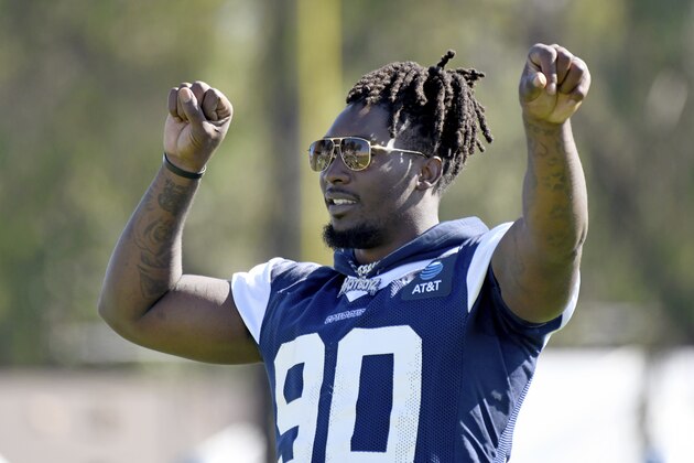 Dallas Cowboys defensive end Demarcus Lawrence directs his teammates during a drill at the NFL football team's training camp in Oxnard, Calif., Saturday, July 27, 2019. (AP Photo/Michael Owen Baker)