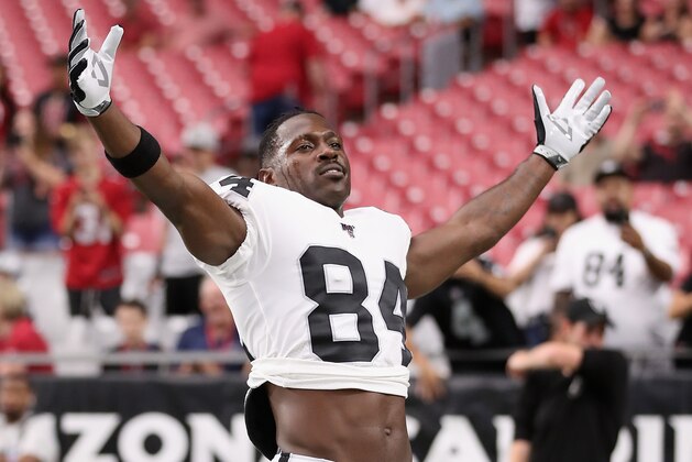 GLENDALE, ARIZONA - AUGUST 15:  Wide receiver Antonio Brown #84 of the Oakland Raiders reacts to fans as he warms up before the NFL preseason game against the Arizona Cardinals at State Farm Stadium on August 15, 2019 in Glendale, Arizona. (Photo by Christian Petersen/Getty Images)
