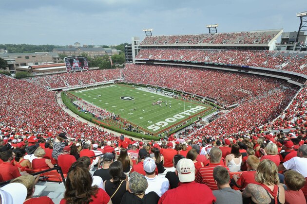 In this Sept. 5, 2015, photo, Georgia fans watch the season opening game against Louisiana Monroe at Sanford Stadium during an NCAA college football game in Athens, Ga. Some University of Georgia fans will be able to buy beer during football games - but only donors who have agreed to give tens of thousands of dollars will be allowed to drink. UGA Athletic Director Greg McGarity told the Atlanta Journal-Constitution on Wednesday, May 29, 2019, that beer and wine will be sold in Sanford Stadium’s premium seating area during the 2019 football season.  (AP Photo/John Amis)