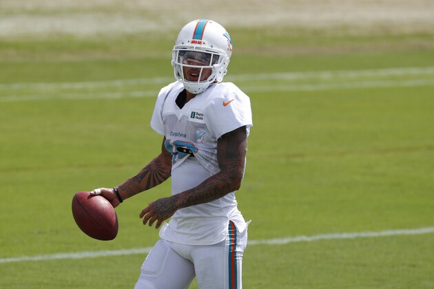 Miami Dolphins wide receiver Kenny Stills runs drills during practice at the NFL football team's training camp, Monday, Aug. 19, 2019, in Davie, Fla. Ryan Fitzpatrick is expected to start the Miami Dolphins' exhibition game this week, which suggests he's still the front-runner in his battle with Josh Rosen for the starting job. (AP Photo/Wilfredo Lee)