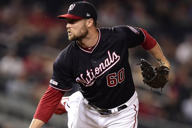WASHINGTON, DC - AUGUST 13: Hunter Strickland #60 of the Washington Nationals pitches in the seventh inning against the Cincinnati Reds at Nationals Park on August 13, 2019 in Washington, DC. (Photo by Patrick McDermott/Getty Images)