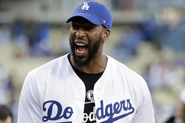 Los Angeles Lakers' Anthony Davis smiles before throwing the ceremonial first pitch before a baseball game between the Los Angeles Dodgers and the Toronto Blue Jays Tuesday, Aug. 20, 2019, in Los Angeles. (AP Photo/Marcio Jose Sanchez)