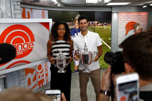 NEW YORK, NY - SEPTEMBER 10:  Novak Djokovic of Serbia and Naomi Osaka of Japan hold their winners trophies at NBC's TODAY Show on September 10, 2018 in New York City.  (Photo by Julian Finney/Getty Images)