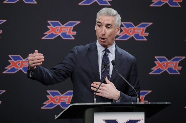 XFL Football Commissioner Oliver Luck talks to reporters before introducing former NFL football quarterback Jim Zorn as the head coach for Seattle's XFL football team, Monday, Feb. 25, 2019, in Seattle. The team will begin play in 2020. (AP Photo/Ted S. Warren)