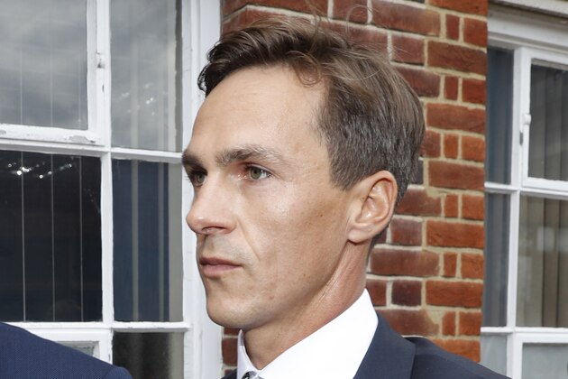Danish golfer and Ryder Cup winner Thorbjorn Olesen, left, arrives at Uxbridge Magistrates court in London, Wednesday, Aug. 21, 2019, after being charged with sexual assault, being drunk on an aircraft and common assault. Olesen was arrested on 29 July after returning from the WGC St Jude Invitational on a flight from Nashville to London. Police were waiting for the 29-year-old when the aircraft landed at Heathrow.(AP Photo/Alastair Grant)