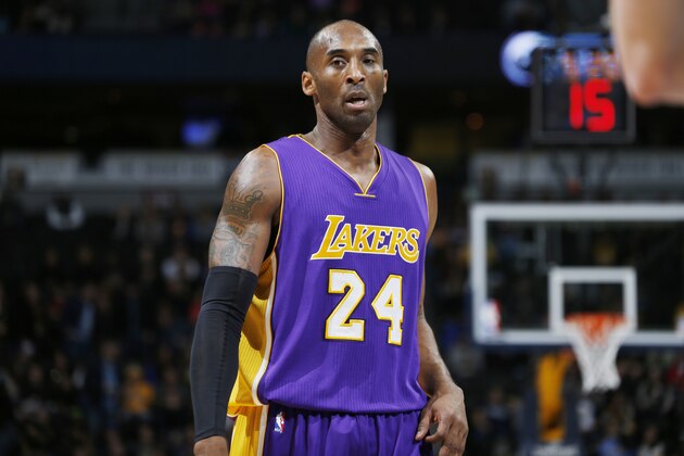 Los Angeles Lakers guard Kobe Bryant looks on against the Denver Nuggets in the first quarter of an NBA basketball game Tuesday, Dec. 30, 2014, in Denver. (AP Photo/David Zalubowski)