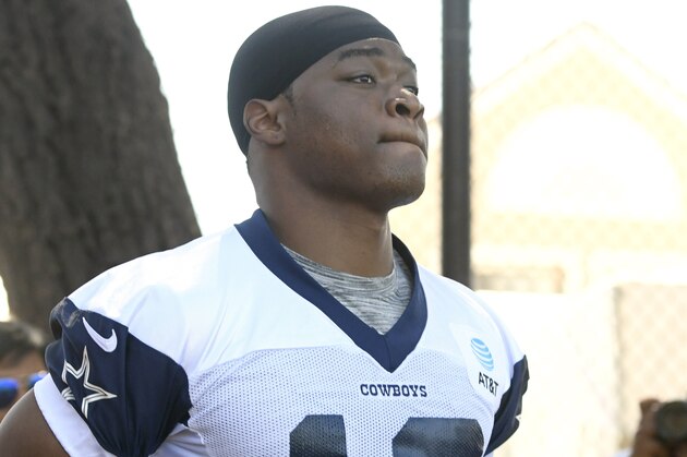 FILE - In this July 27, 2019, file photo, Dallas Cowboys wide receiver Amari Cooper jogs onto the field at the NFL football team's training camp in Oxnard, Calif. Dak Prescott pretends he can’t hear the question when the subject turns to a new contract for the star quarterback of the Dallas Cowboys, while receiver Amari Cooper steadfastly says he simply doesn’t think about what might be happening in his negotiations. Both reported to training camp on time as they prepare for the final year of their respective deals. (AP Photo/Michael Owen Baker, File)