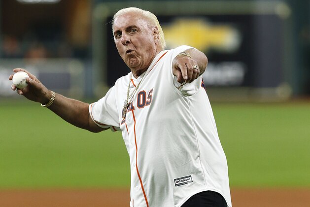 HOUSTON, TEXAS - AUGUST 21: Professional wrestler Ric Flair throws out the first pitch before a baseball game between the Detroit Tigers and Houston Astros at Minute Maid Park on August 21, 2019 in Houston, Texas. (Photo by Bob Levey/Getty Images)